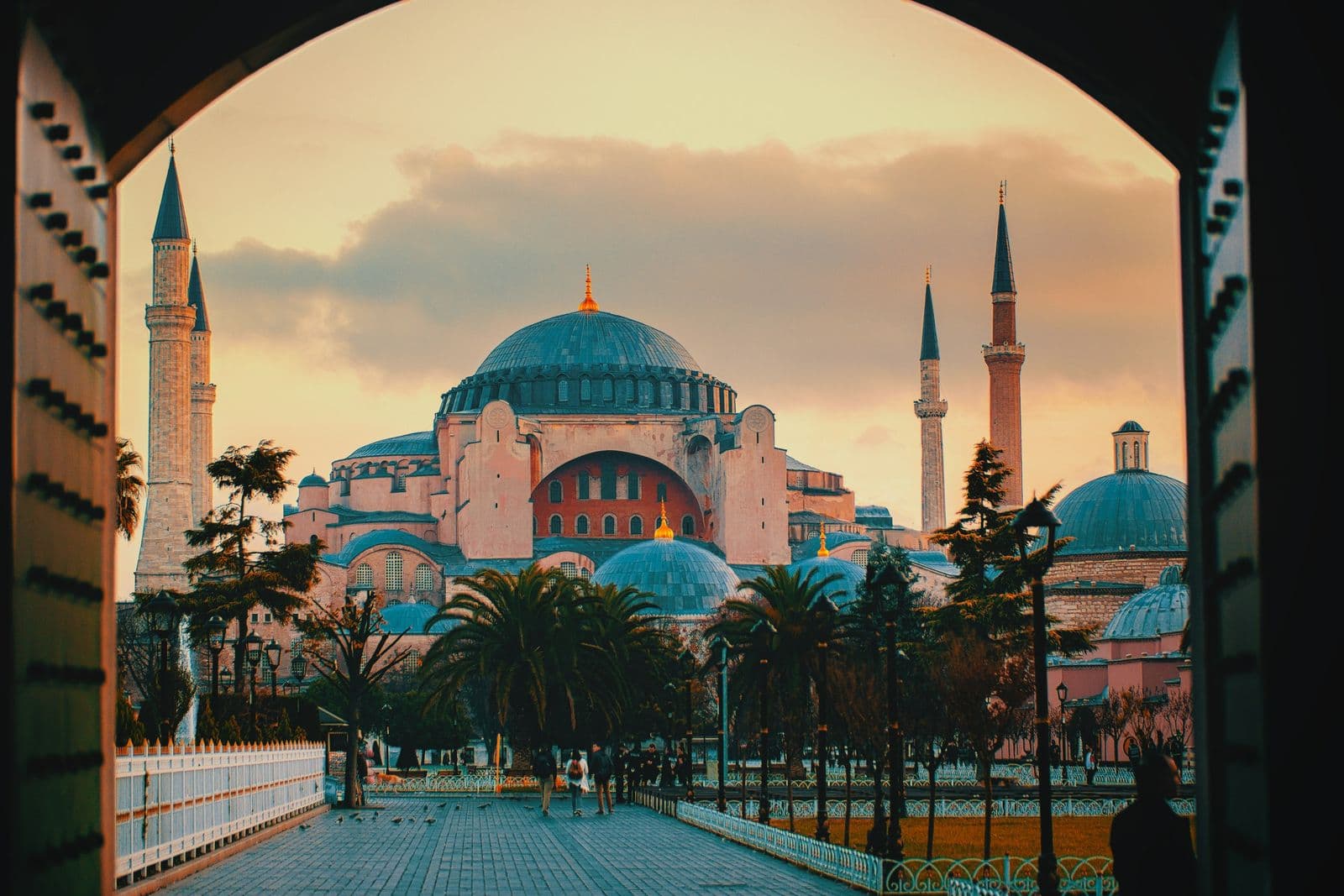 Hagia Sophia in Istanbul in evening light, seen through an arched gateway
